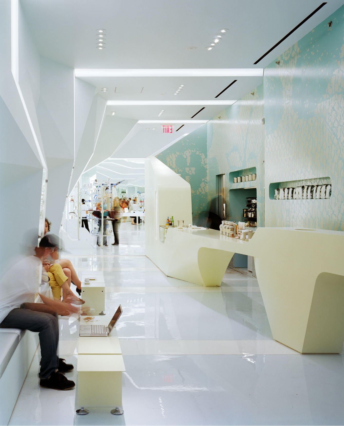 Alessi Flagship café area with 3D-milled counter, recessed seating, and custom wall graphic