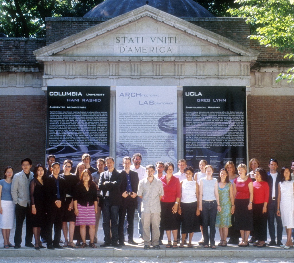 The full group of participants in front of the U.S. Pavilion at the 7th Venice Architecture Biennale — Columbia GSAPP and UCLA students with Hani Rashid and Greg Lynn, beneath the ARCH LAB exhibition banners