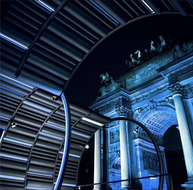 Close-up of the tubular ring structure framing the Arco della Pace at night