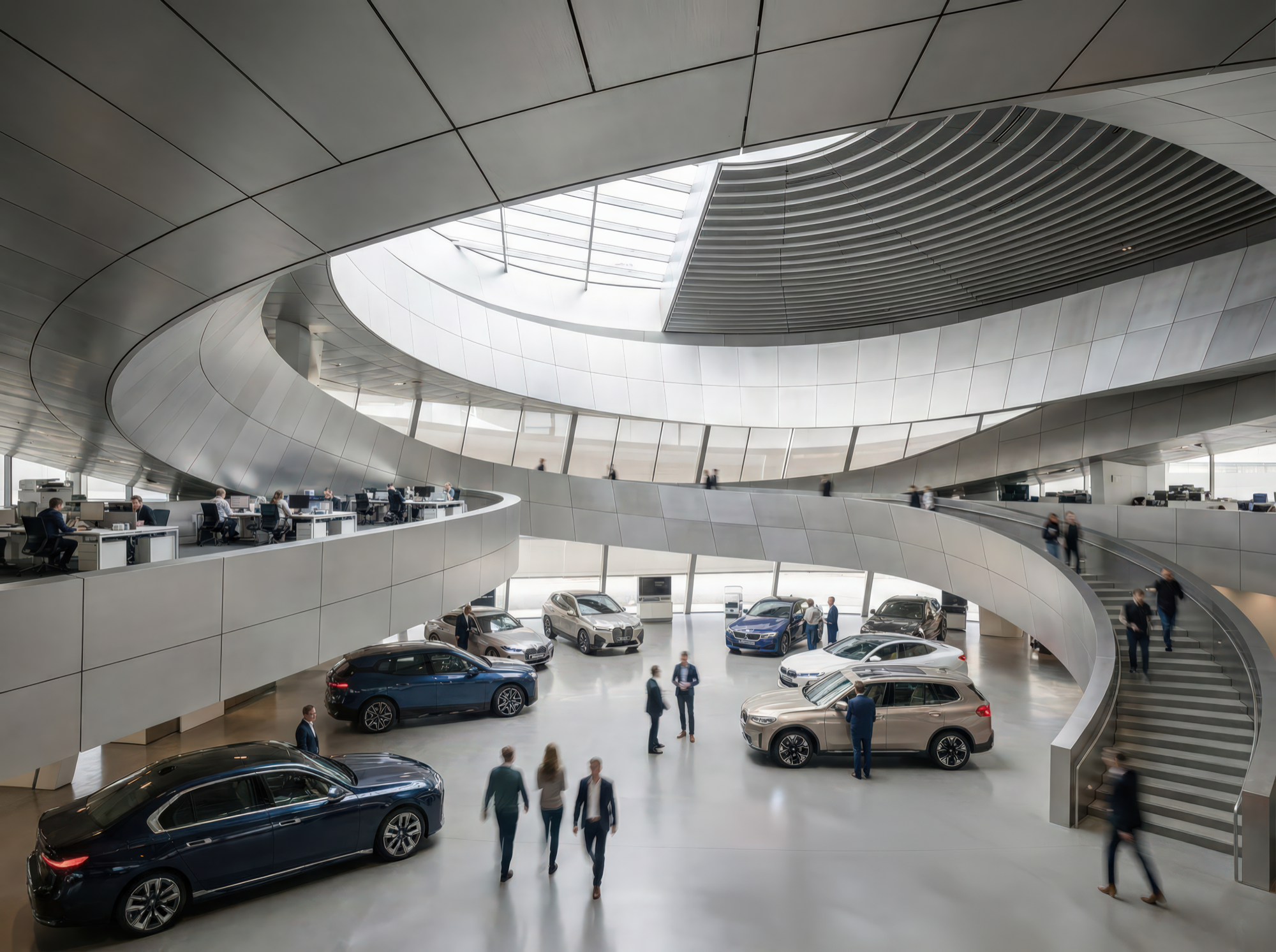 Vehicle delivery hall interior with spiraling mezzanine ramp, curved metallic ceiling, BMW vehicles on display, and visitors