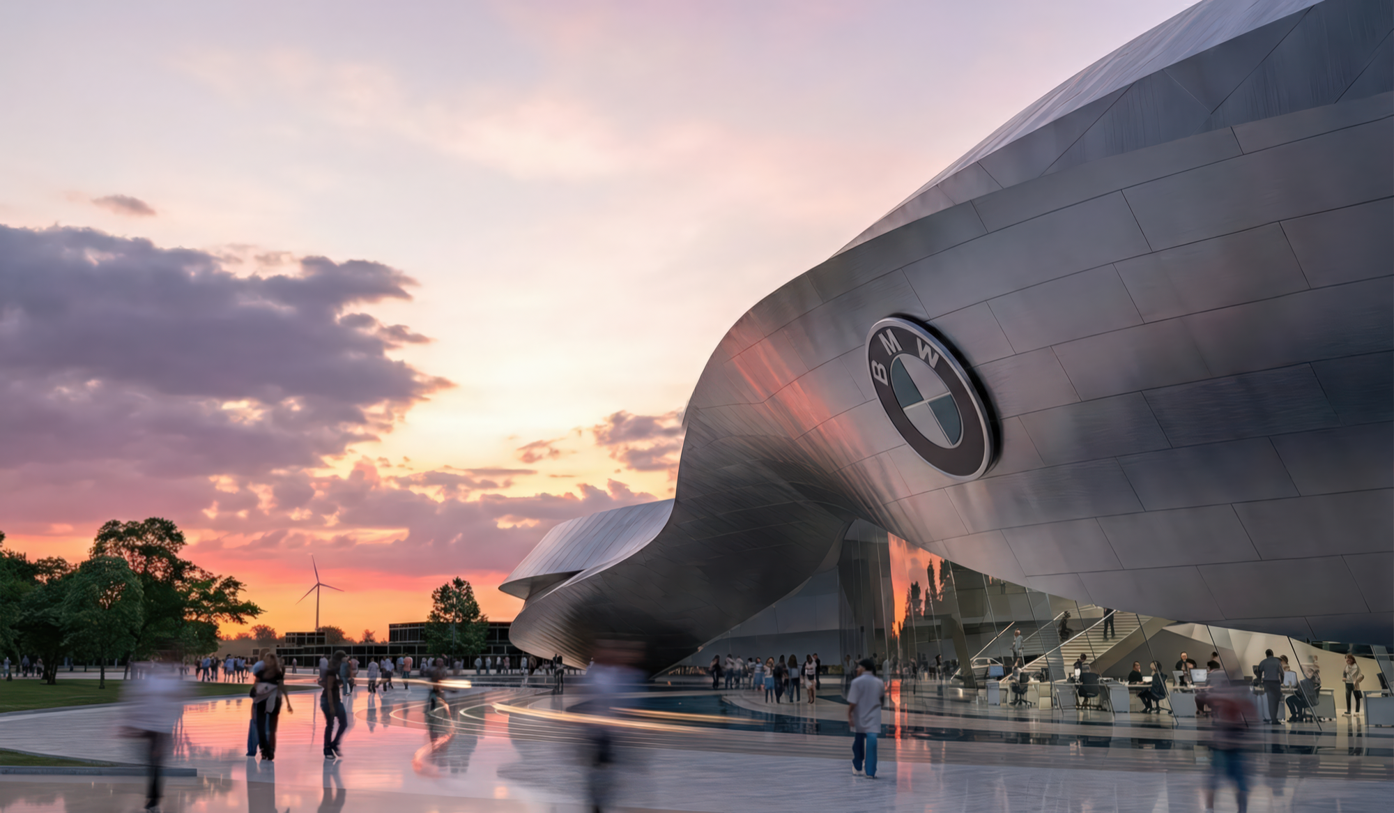 Exterior view of the BMW Event and Delivery Centre at sunset with the iconic BMW logo on the sculptural metallic facade and visitors on the wet plaza