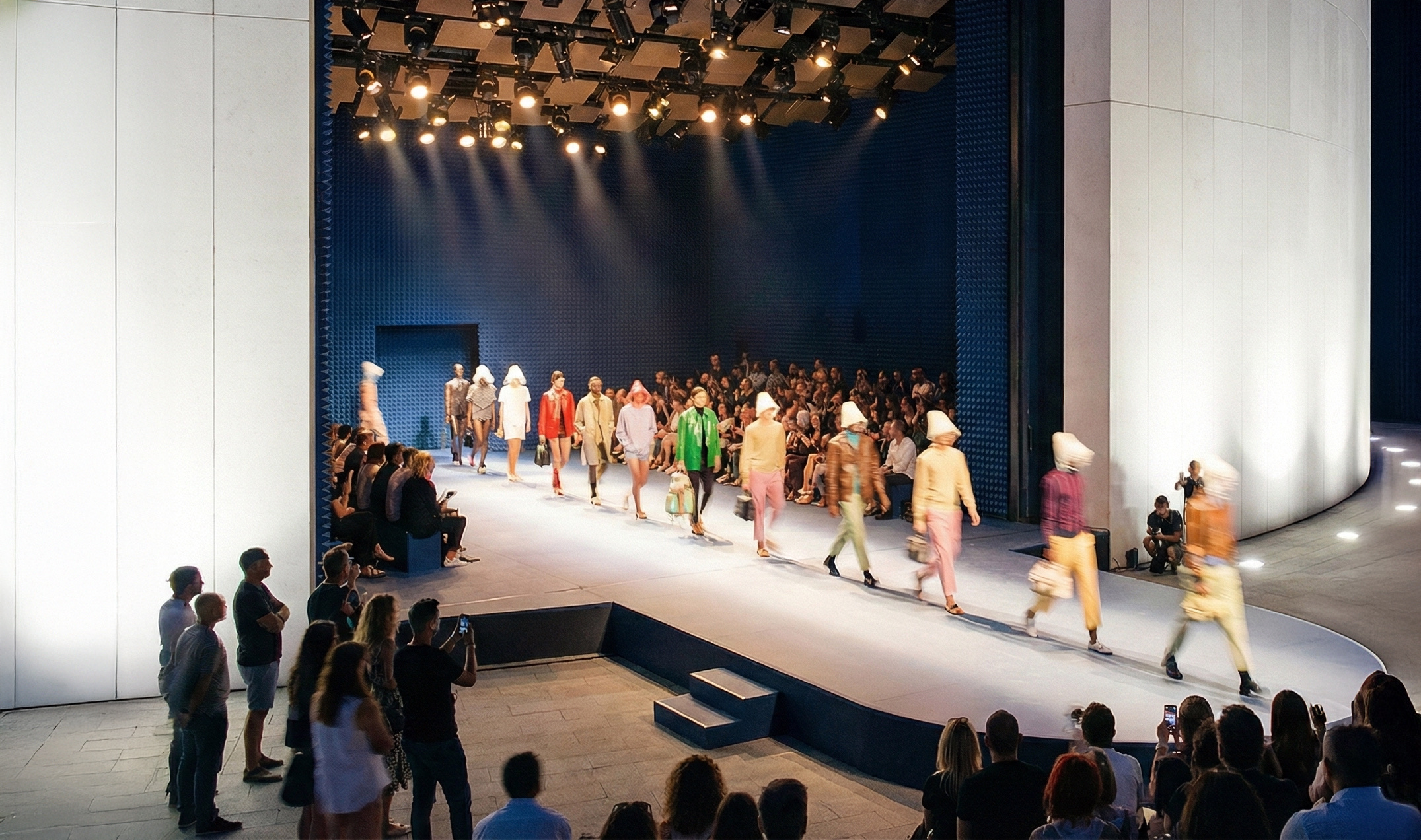Performance hall interior with audience seated beneath a sculptural ceiling canopy