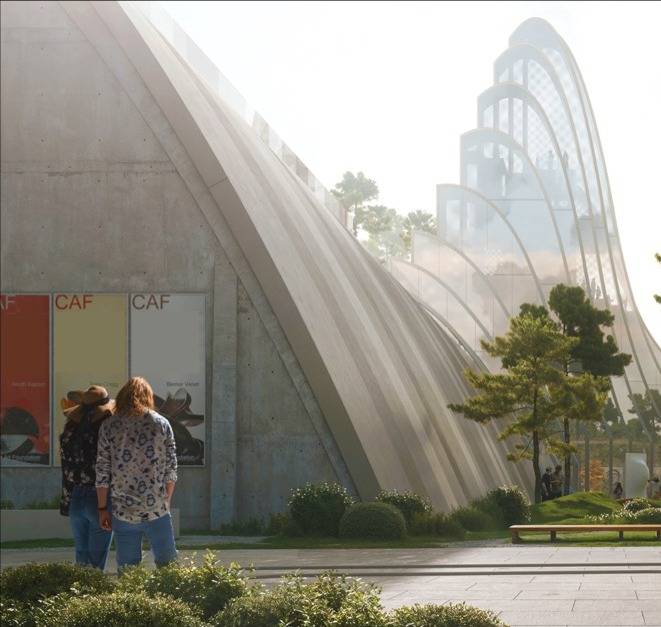 Carob Arts Center entrance with visitors viewing CAF exhibition banners beneath sweeping concrete forms