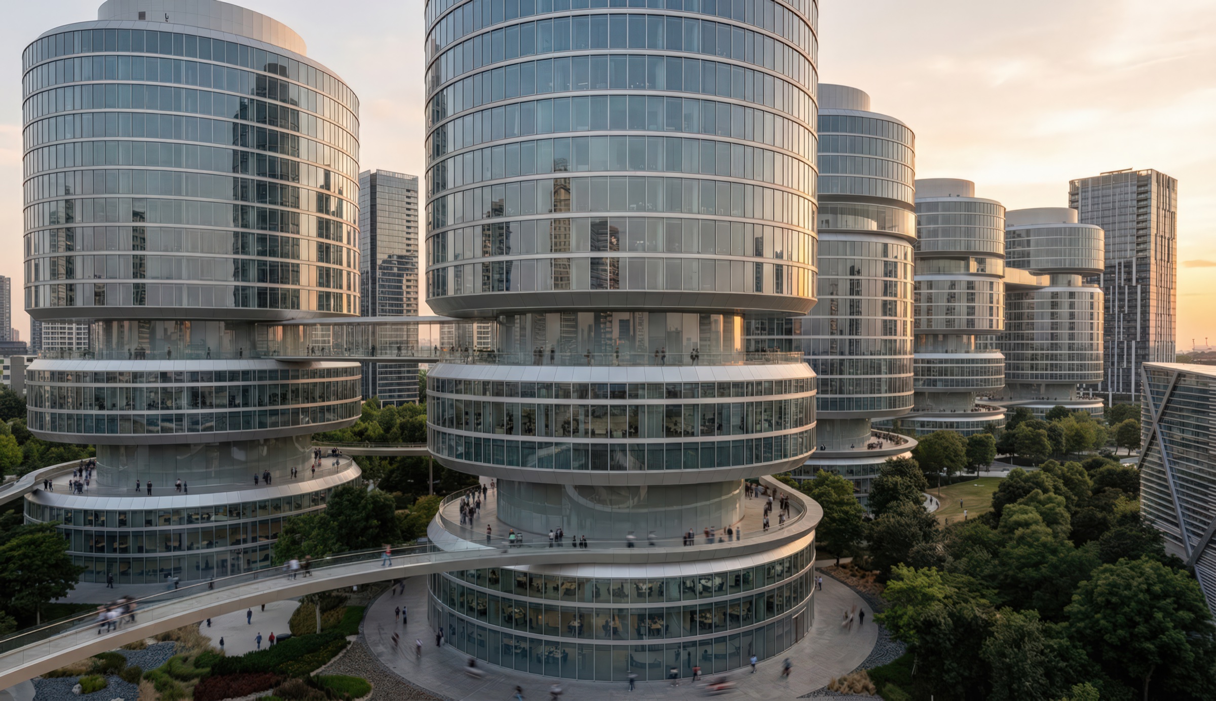 Cylindrical glass towers with spiraling landscaped terraces wrapping their bases, interconnected by elevated walkways and pedestrian plazas, at golden hour