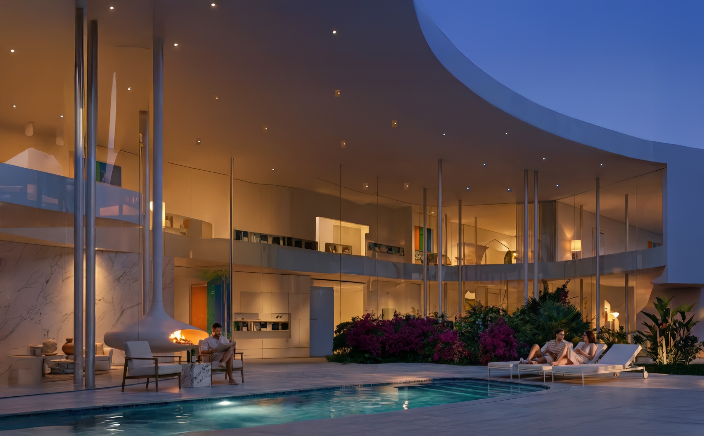 Poolside view at dusk with the curving white canopy overhead, warmly lit interiors visible through glass walls, fireplace, lounge seating, and tropical plantings