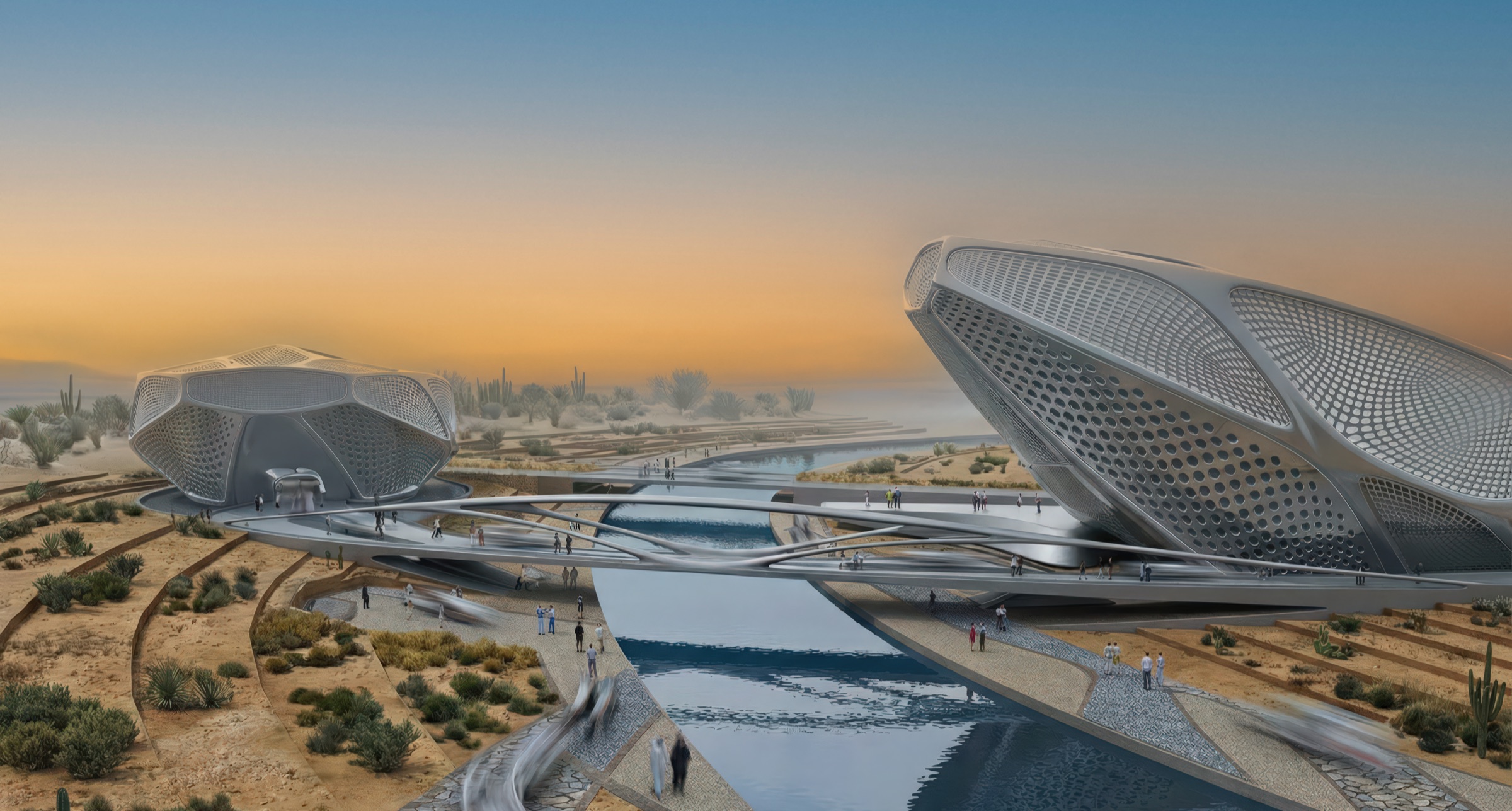 Twilight exterior view of the two Guggenheim Digital Art Pavilions at the edge of a desert waterway, showing the pair of faceted lens-shaped volumes with perforated shells elevated on sculpted bases above water channels, linked by bridges, with visitors on the walkways and the desert landscape extending to a distant hazy horizon