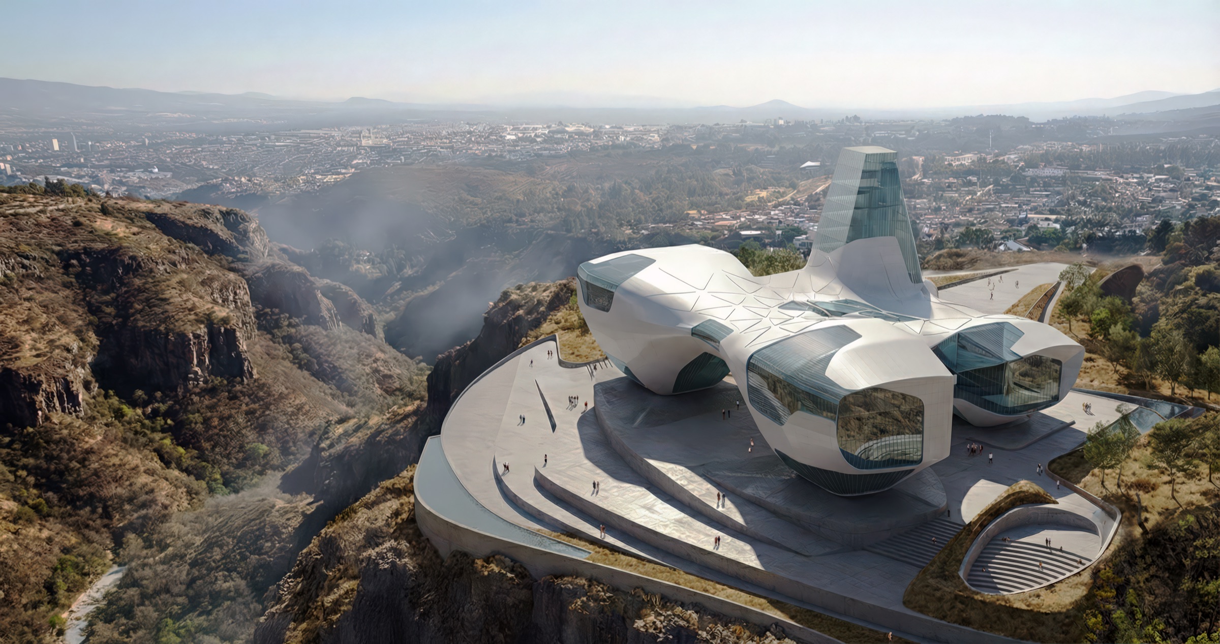 Aerial view of the Guggenheim Guadalajara at the edge of the Barranca canyon, showing the sweeping white museum volume cantilevered above a public plaza with Guadalajara's dense urban fabric extending to the horizon and the vast canyon dropping away to one side