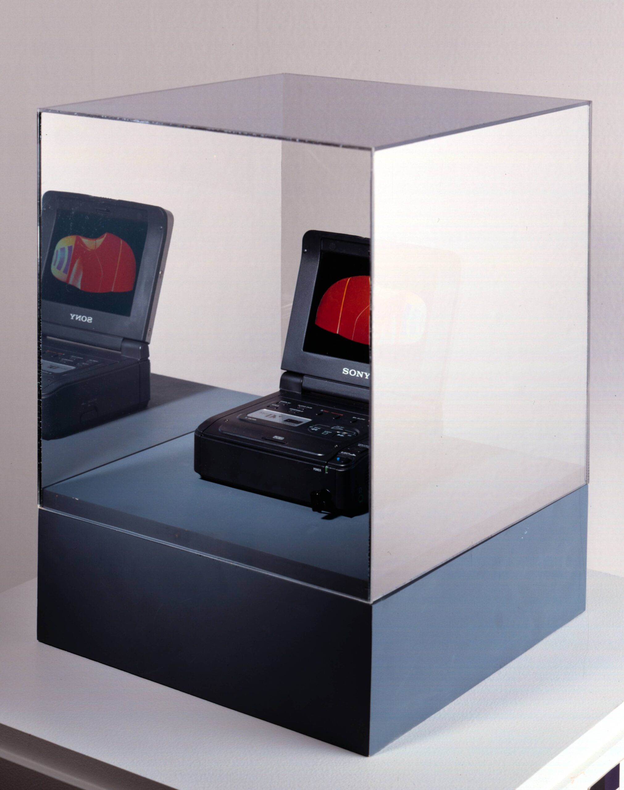 I-Scapes 1.0 — Sony DV player enclosed in Plexiglas vitrine with Adicom infrared timing sensors, morphing video work by Asymptote Architecture