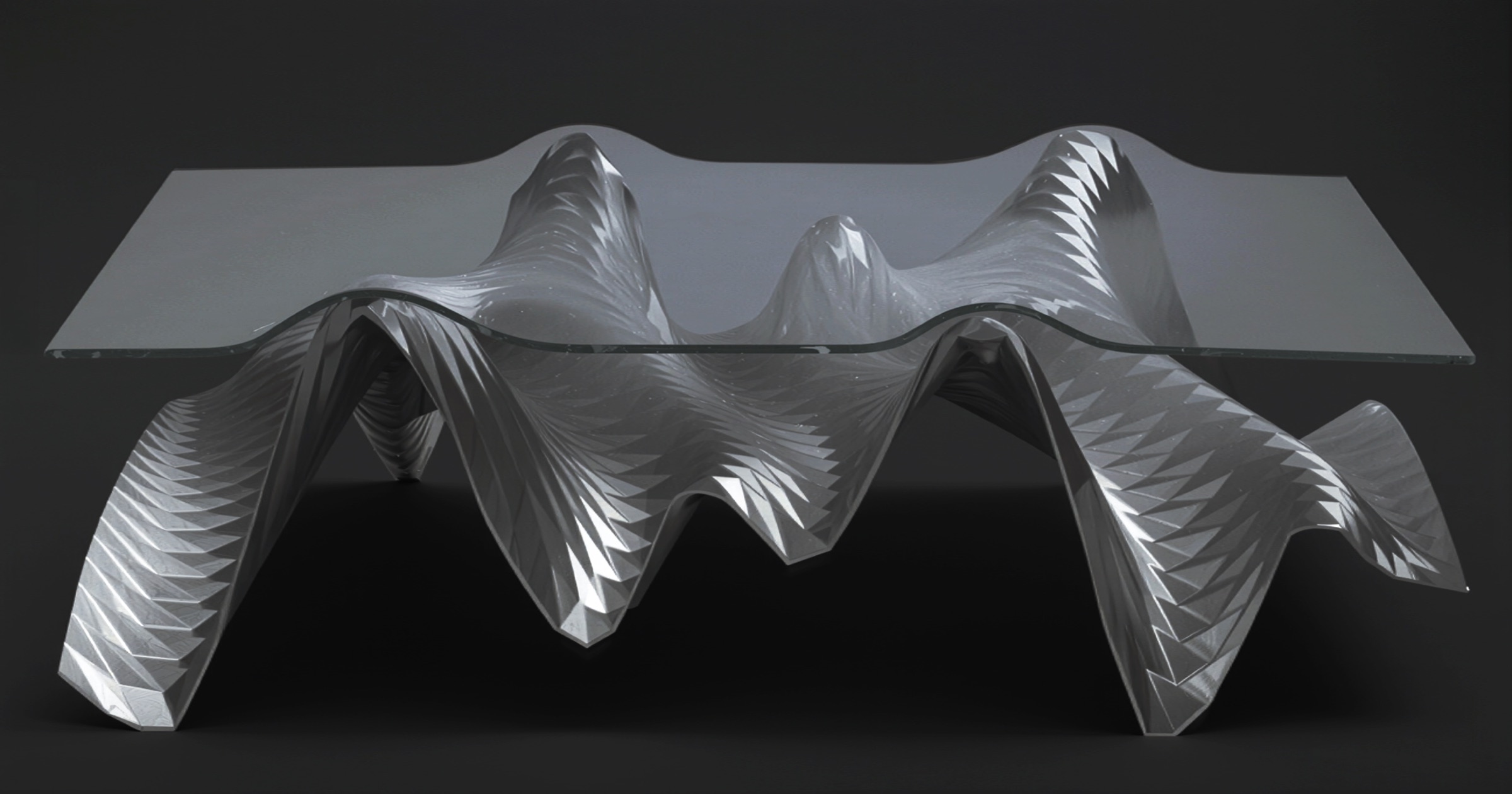 The Ivo_03 table by Hani Rashid and Lise Anne Couture — slumped glass resting on an undulating base of etched Tula steel