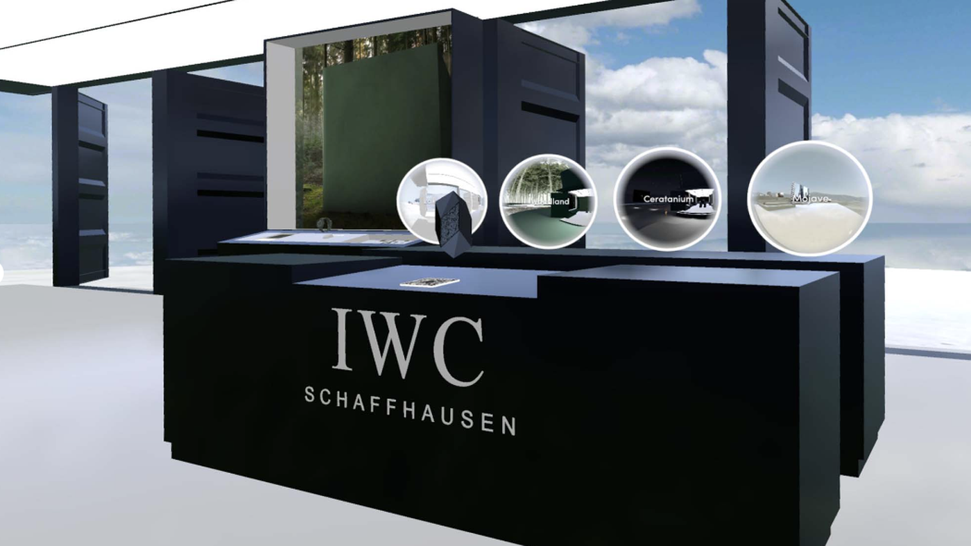 Booth entry with portal screens showing IWC worlds
