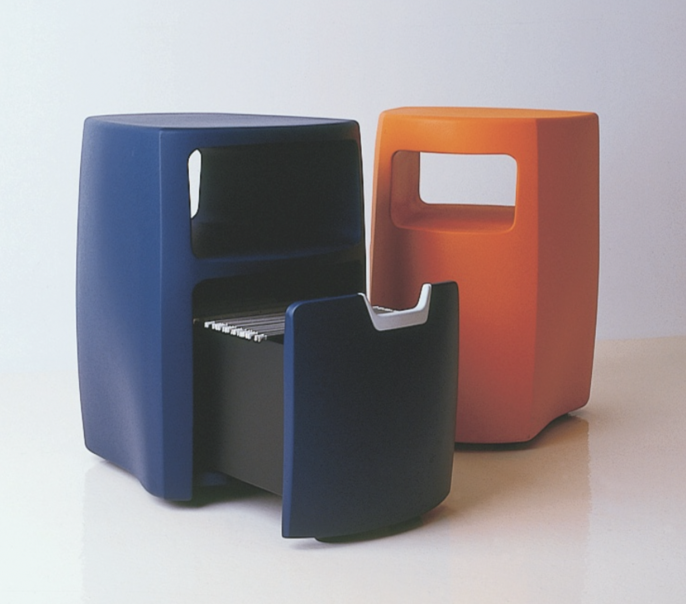 Two A3 mobile storage pedestals in blue and orange with rounded organic forms, the blue unit shown open with hanging file folders and a pull-out drawer