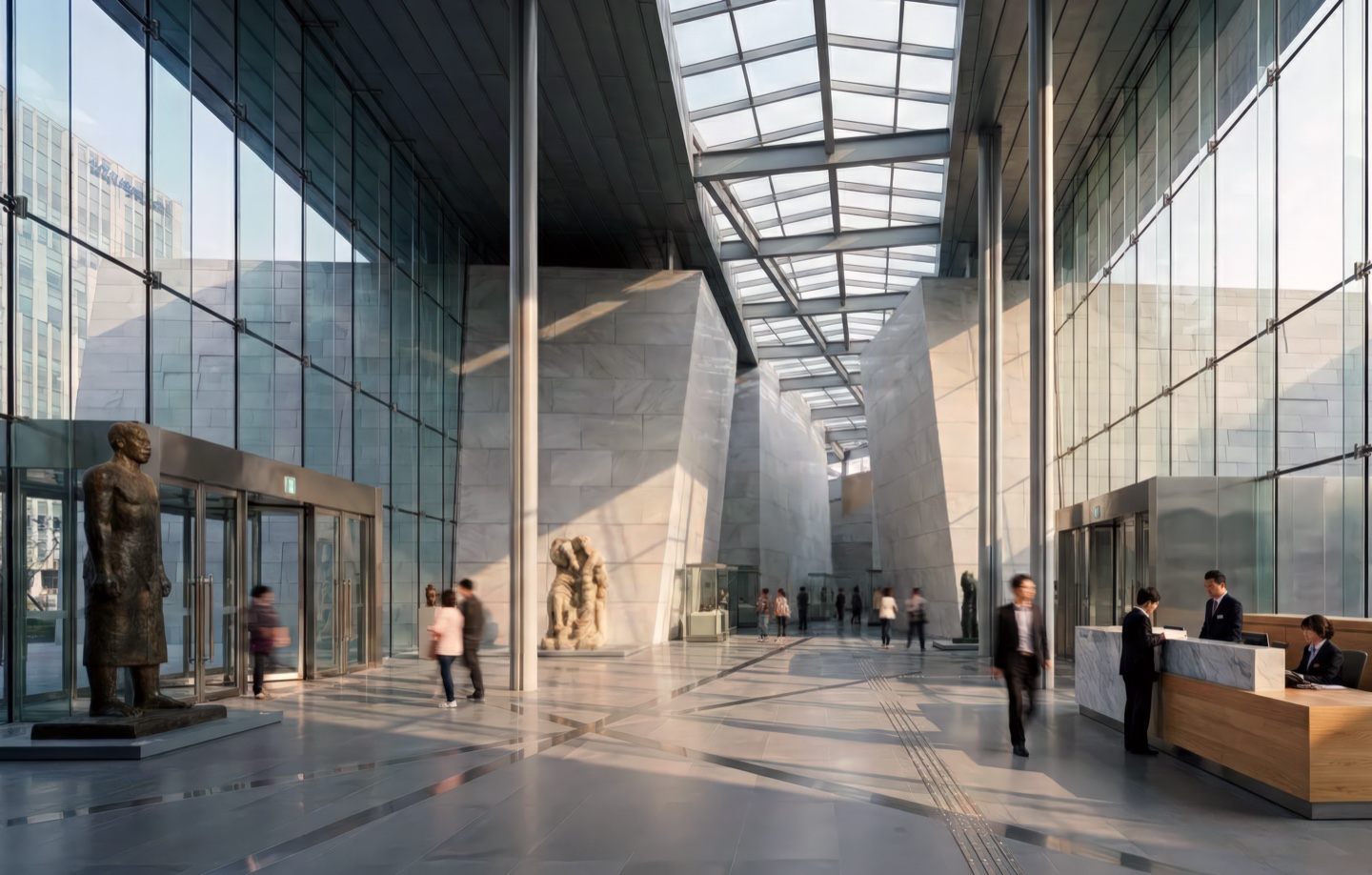 Grand interior atrium with soaring skylight, polished stone floors, and sculptural works flanking a central circulation spine