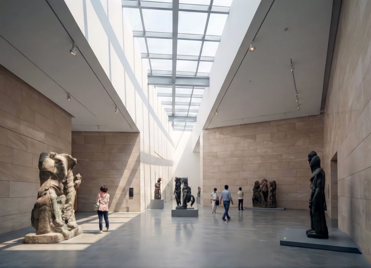 Sculpture hall with dramatic angular stone walls and a continuous skylight casting natural light across large-scale bronze and stone figures