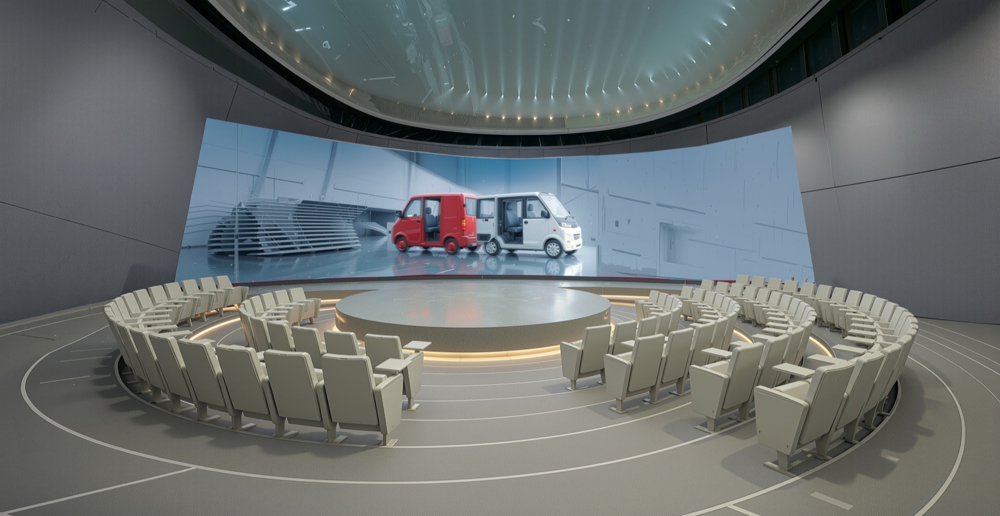 Circular presentation theater with curved panoramic screen, central turntable stage, and tiered seating