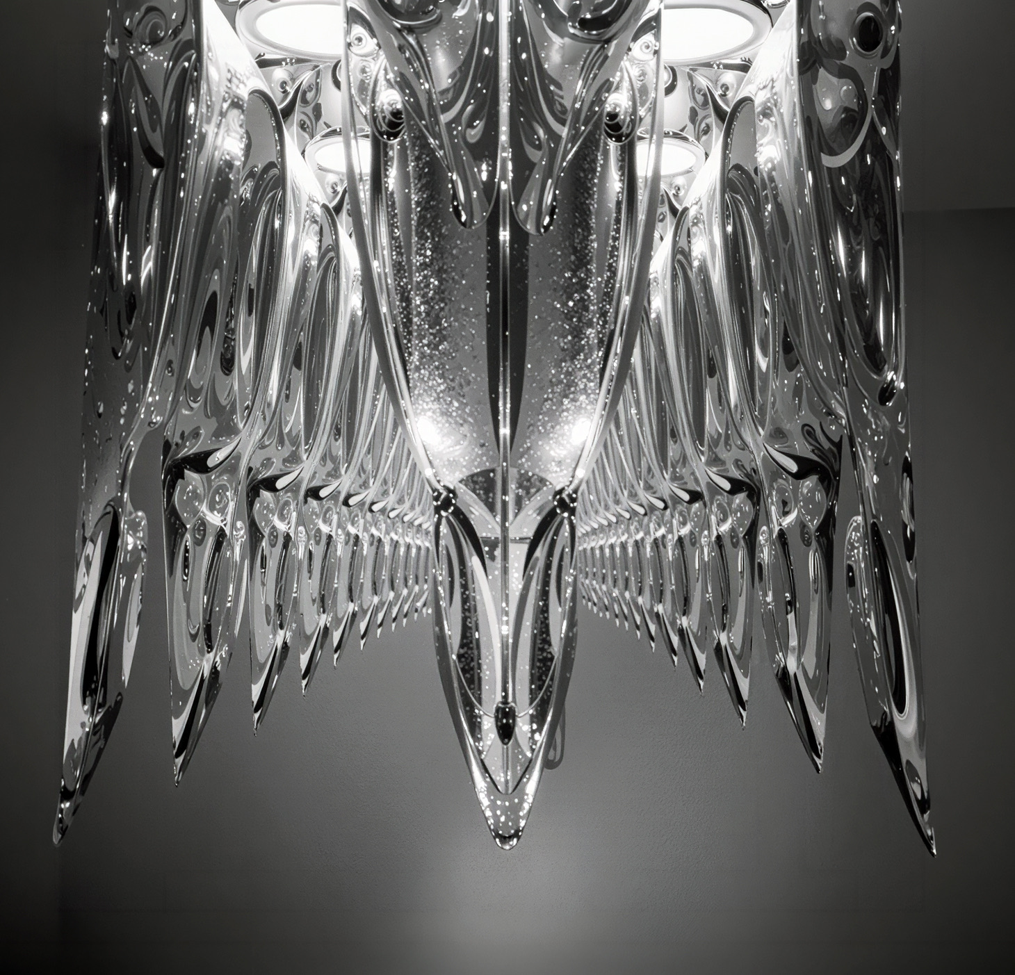 Close-up of the LQ chandelier's chrome-plated modules — light refracts through the clustered minimal-surface forms