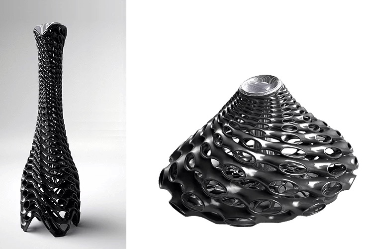 Roi and Fugu vases side by side — the tall lattice-stem Roi beside the broad perforated cone of Fugu, both in black epoxy with chrome interiors
