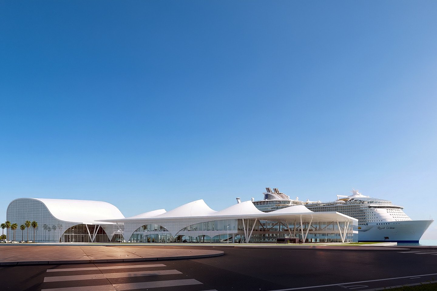 Wide panoramic view of the terminal with its full undulating white canopy and a Royal Caribbean cruise ship docked at berth, palm trees lining the quay