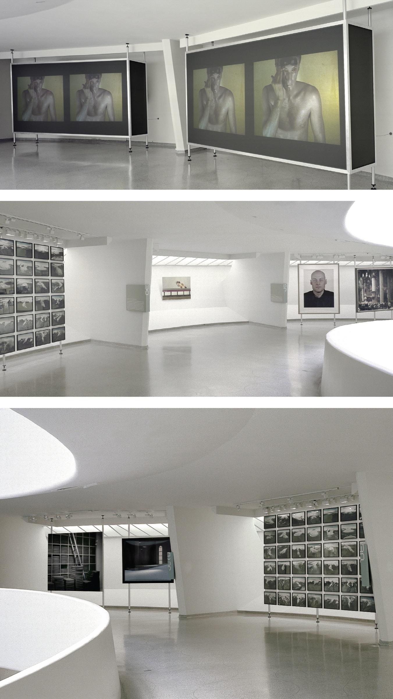 Three views of gallery bays during Moving Pictures — freestanding display frames with large-format photographs and video grids along the curved Guggenheim walls