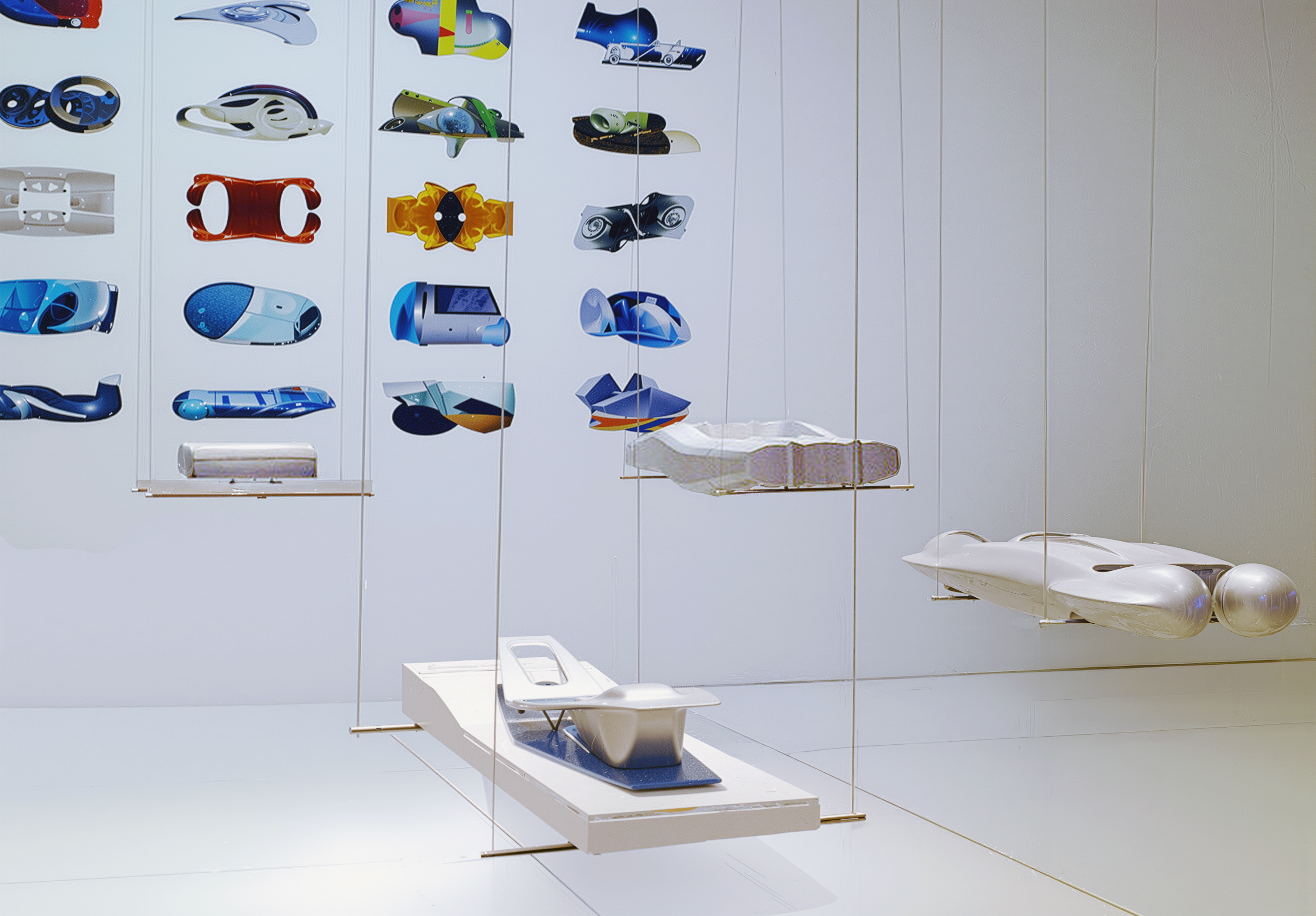 Asymptote's suspended architectural models and project renderings displayed in glass vitrines at Non Standard Architectures, Centre Pompidou