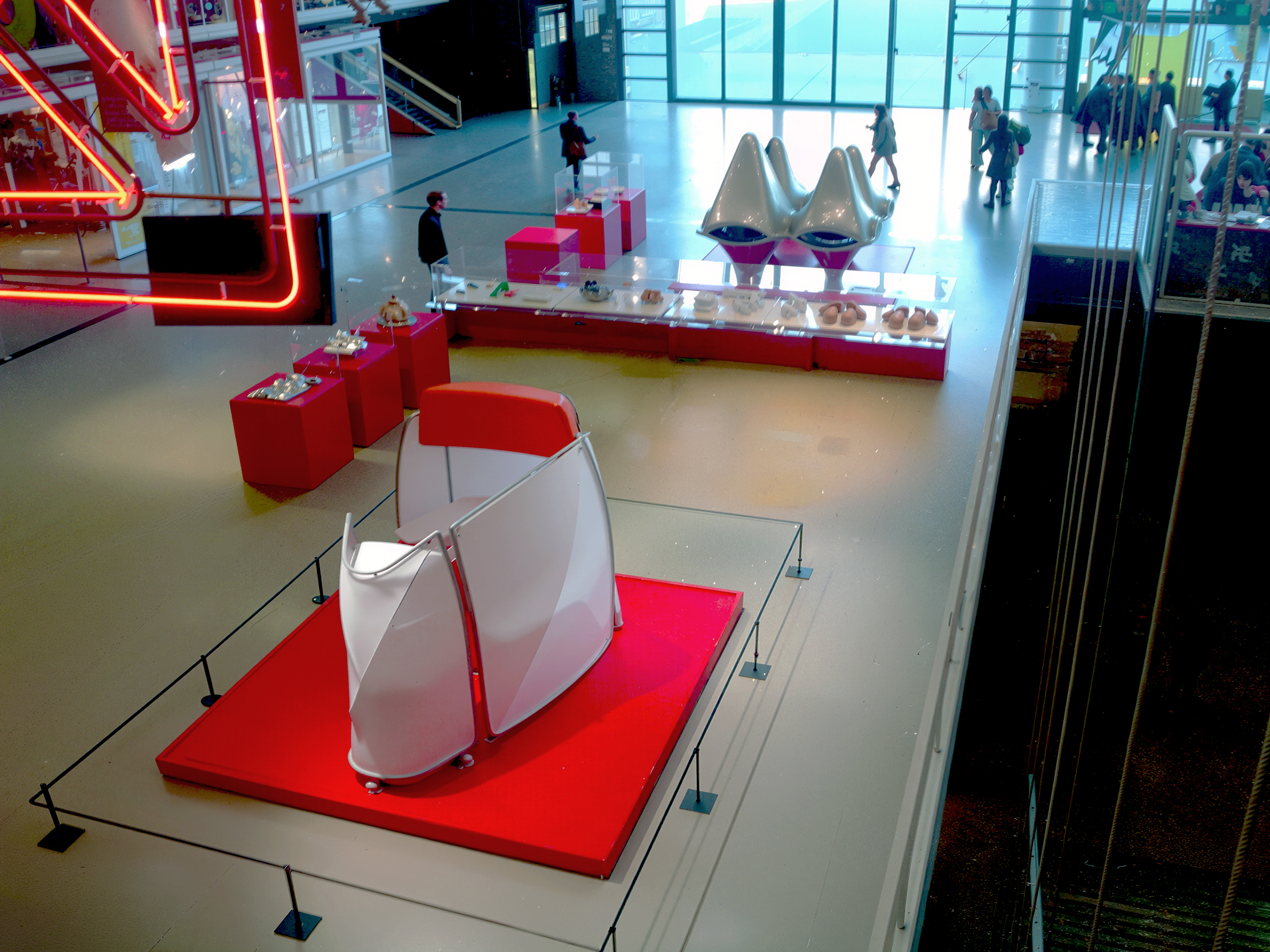Elevated view of the Non Standard Architectures exhibition — Asymptote's white sculptural model on a red platform in the foreground, with the full gallery stretching toward the Pompidou's glass facade