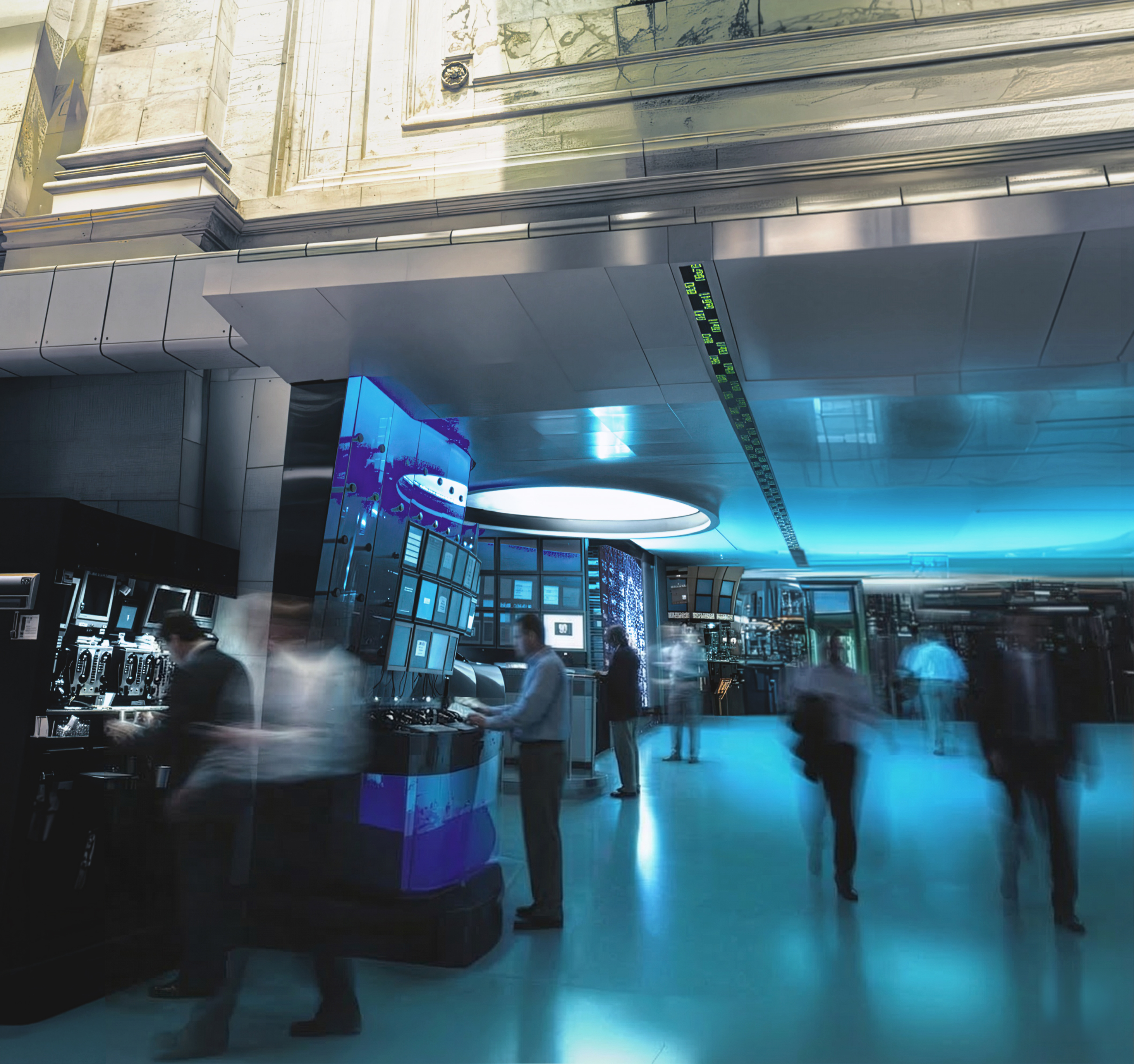 NYSE Advanced Trading Floor command center with blue-lit media displays and oval ceiling element on the trading floor