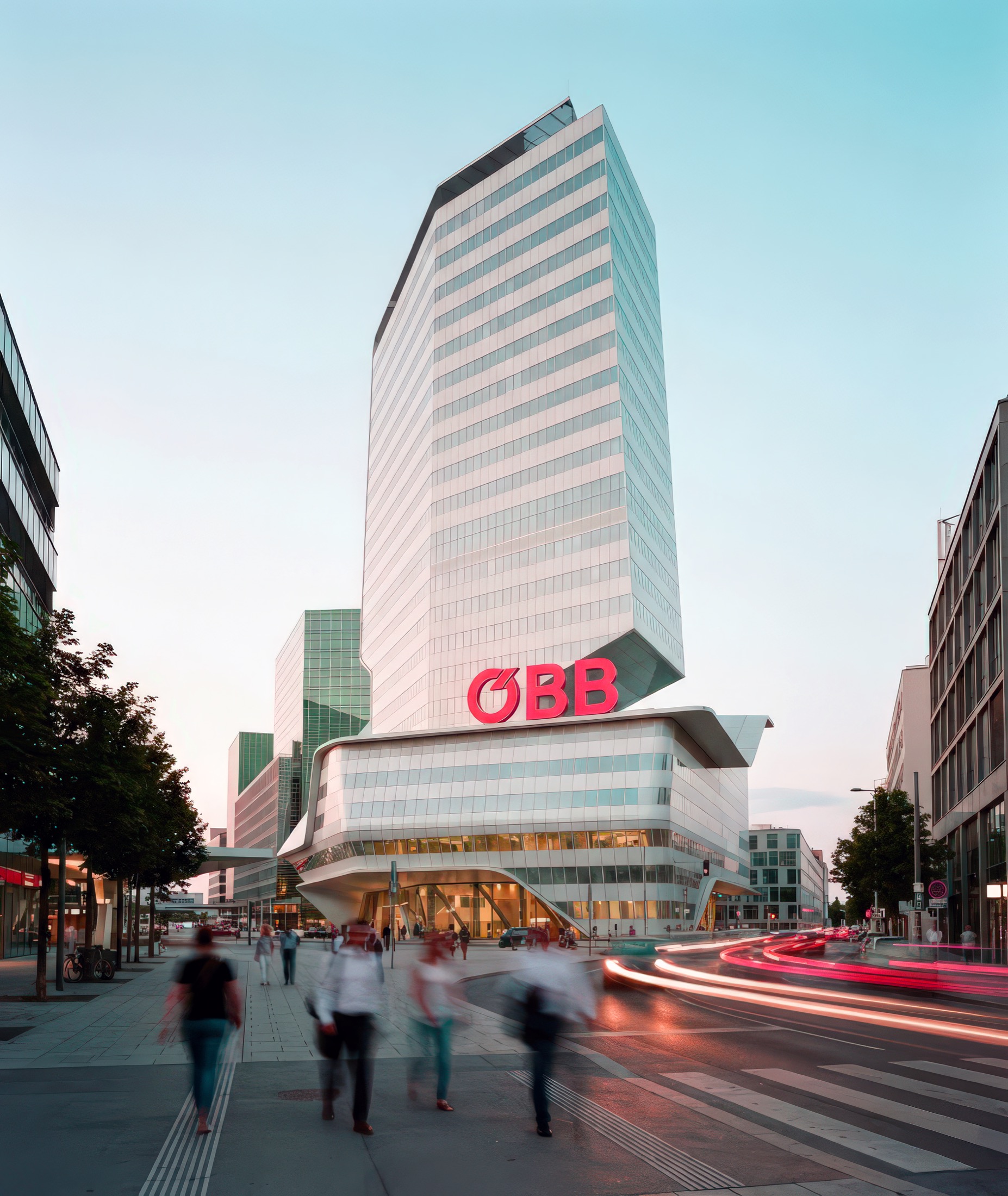 Full-height view of the ÖBB Headquarters tower with its sculptural curved facade rising above the Vienna street