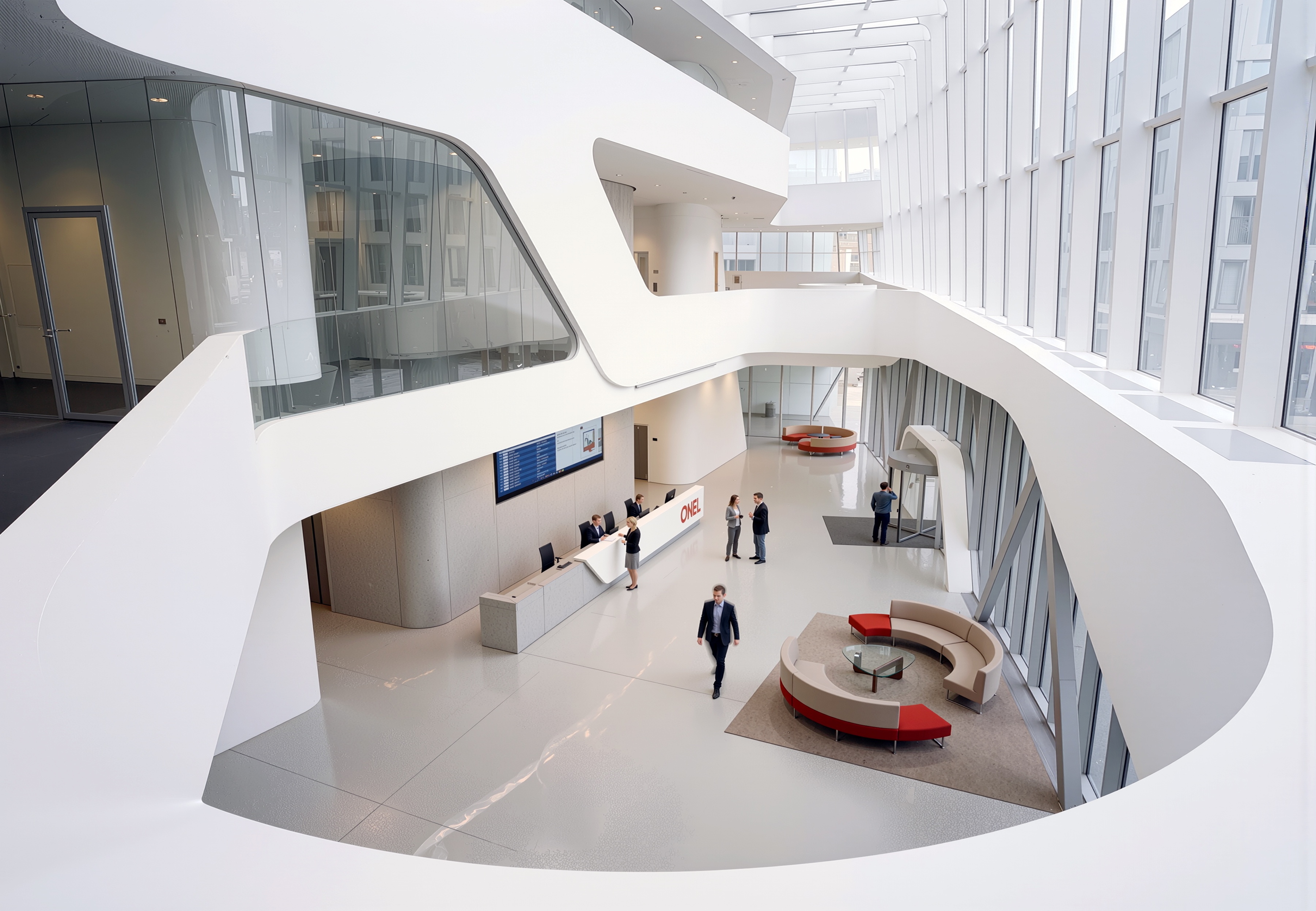 Elevated view of the OBB Corporate Headquarters interior atrium with sweeping white organic balcony forms, a reception desk, and skylights above