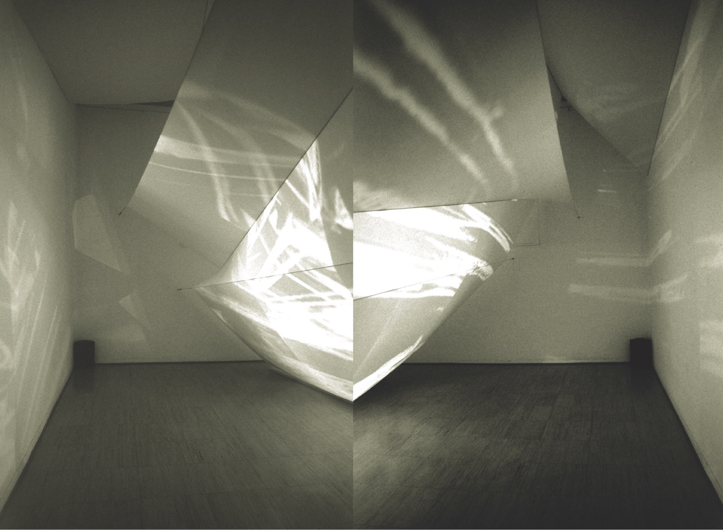 Asymptote's paper installation at the PaperArt Biennale — a faceted sculptural form suspended in a gallery at the Leopold-Hoesch-Museum, Düren, with projected light cascading across its folded surfaces