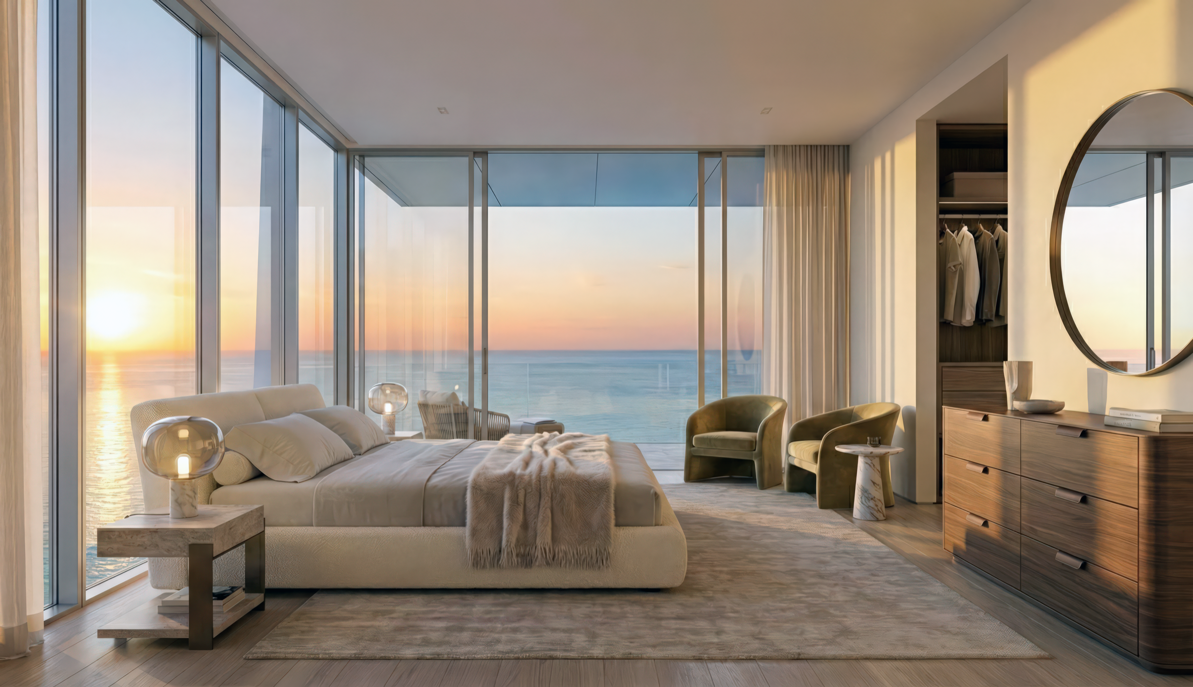 Master bedroom suite with floor-to-ceiling corner glazing framing a panoramic sunrise over the Arabian Gulf, minimalist furnishings, and warm natural light