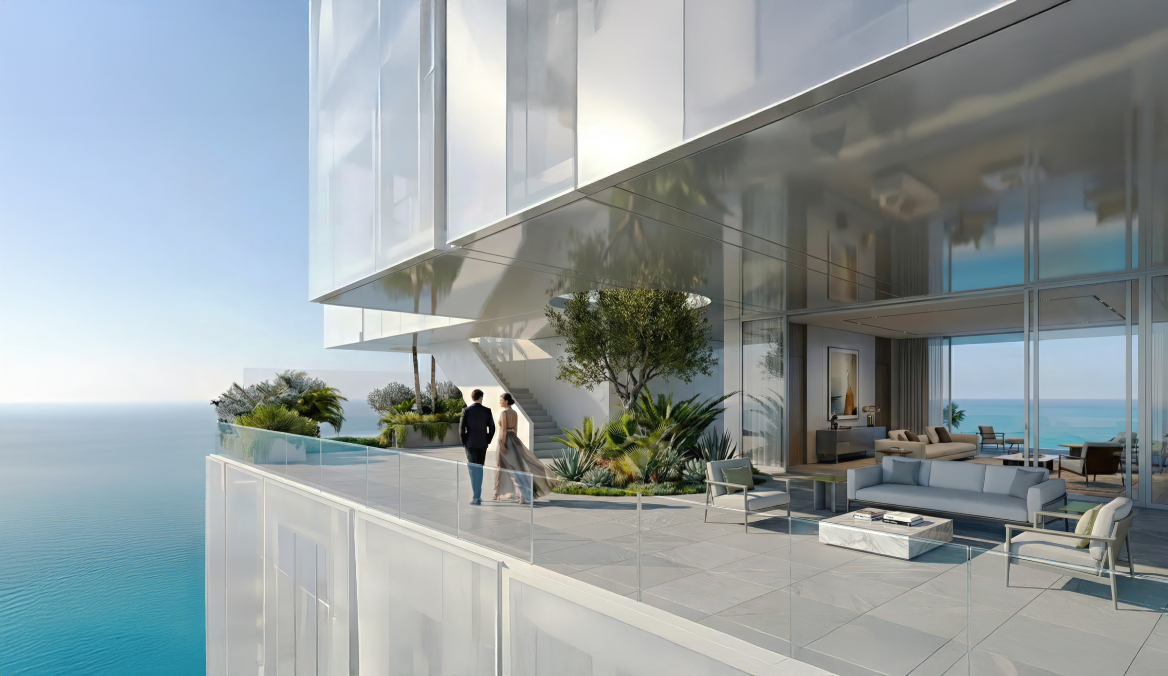 Upper-level sky suite terrace with planted gardens, outdoor living area, a couple looking out over the ocean, and the cantilevered tower volumes above