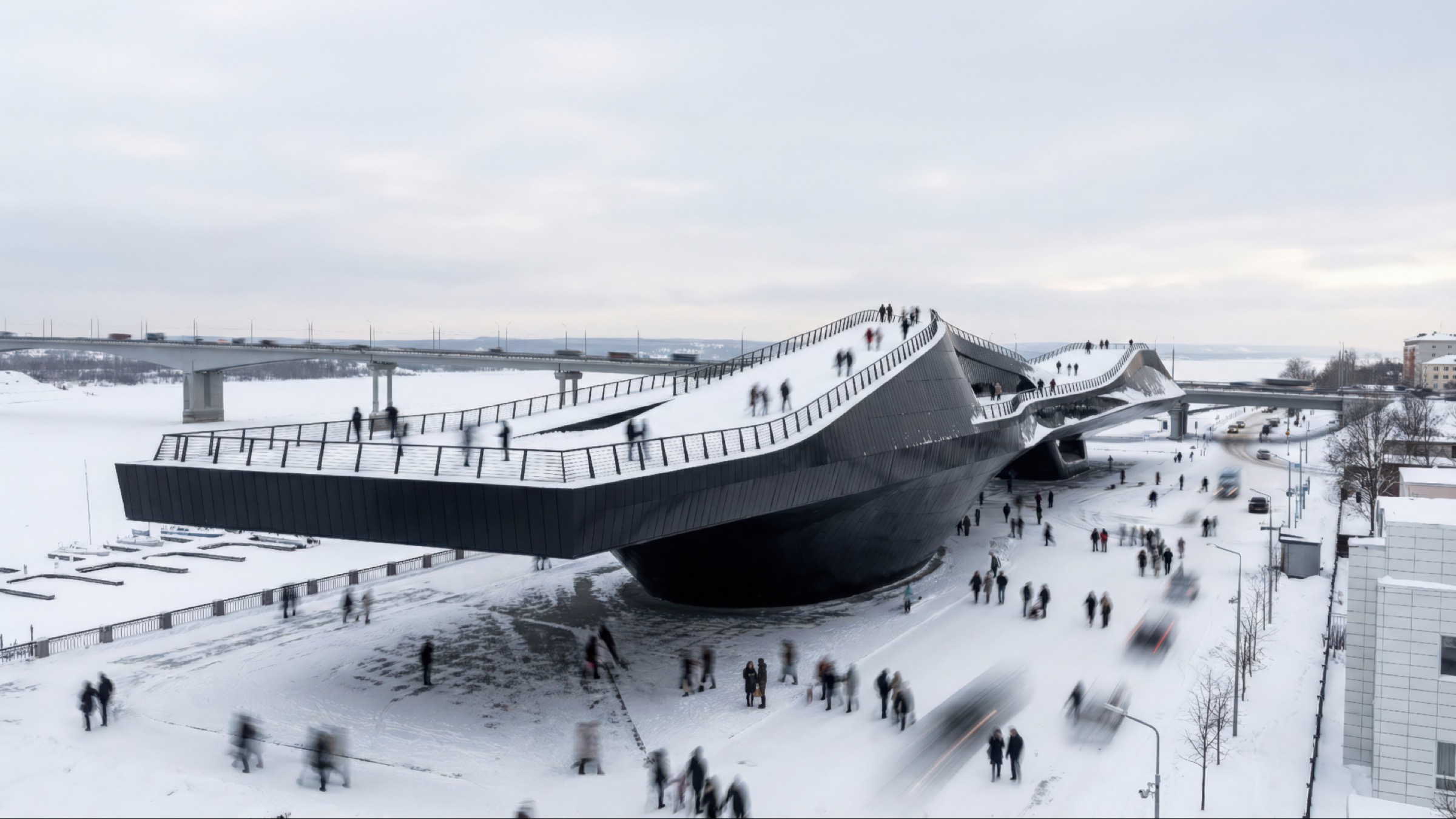 The museum's dark cantilevered volume extending over the waterfront in winter, with crowds moving along the snow-dusted accessible roofscape and the Kama River bridge behind