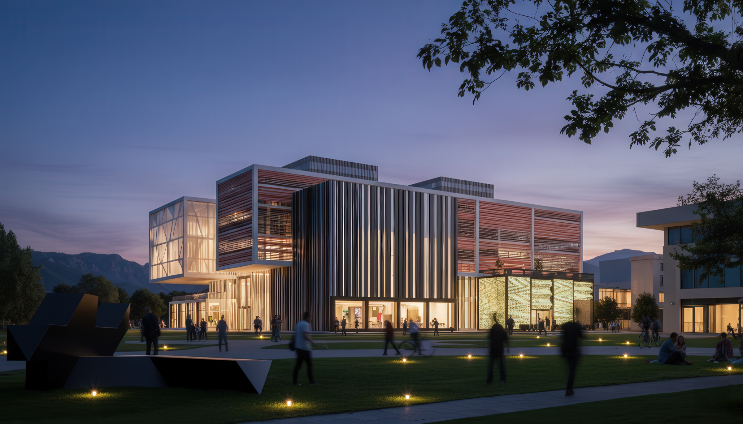 Dusk view of the Central University Library of Montenegro from the campus southwest, showing the layered facade of vertical louvres, red horizontal bands, and faceted white panels illuminated from within, a black angular sculpture on the lawn, visitors on the plaza, and the Montenegrin mountains behind