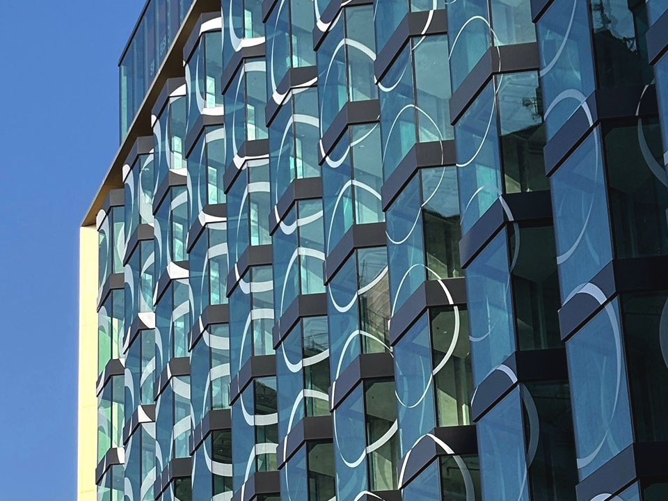 SO/ Budapest Hotel facade detail with circular window elements and Danube riverfront