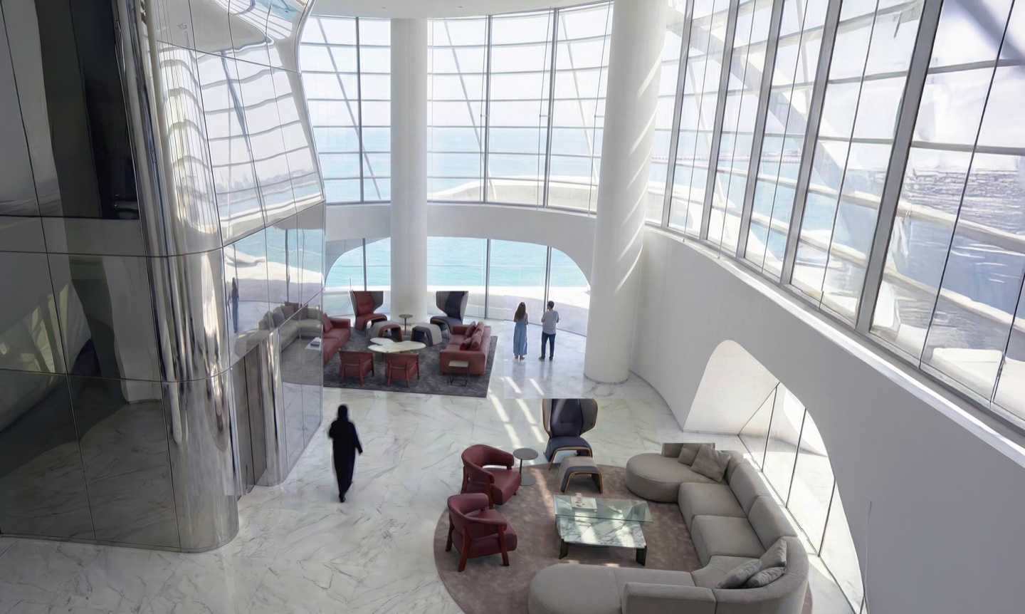 Grand double-height lobby with floor-to-ceiling glazing and ocean views