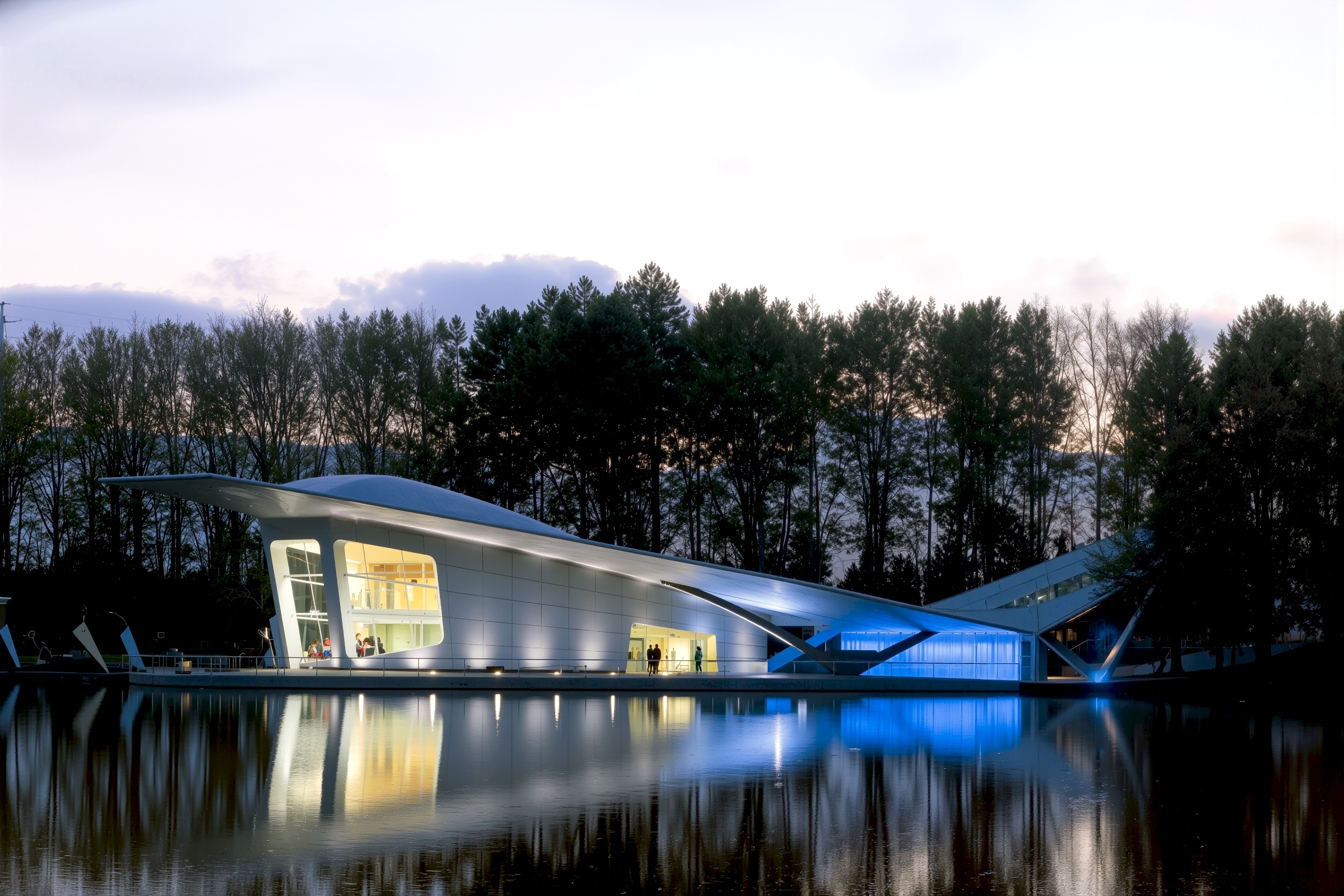 Interior lounge area with views through the glass walls to the surrounding landscape