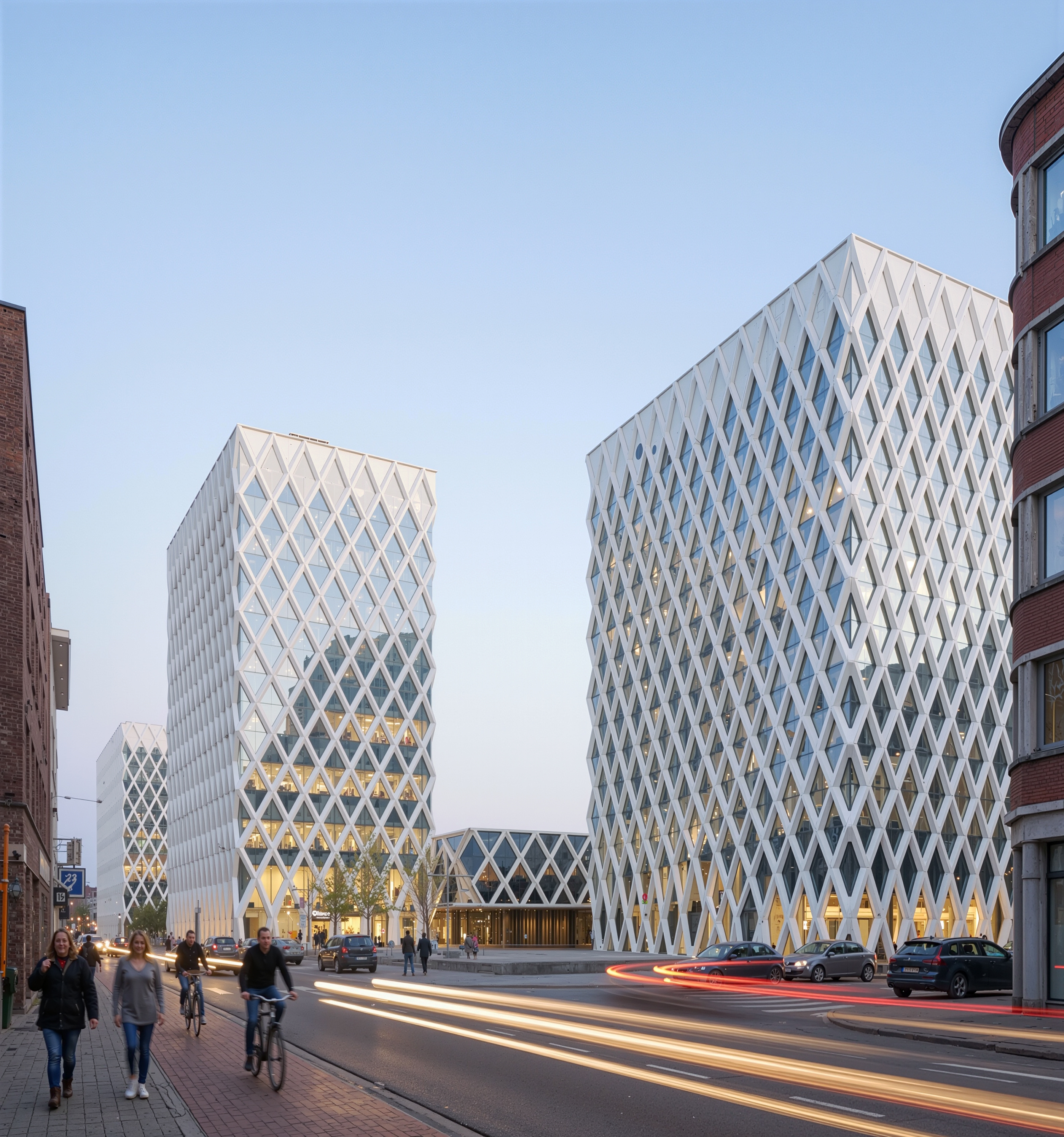 Two diamond-facade towers at dusk seen from the street with cyclists and pedestrians