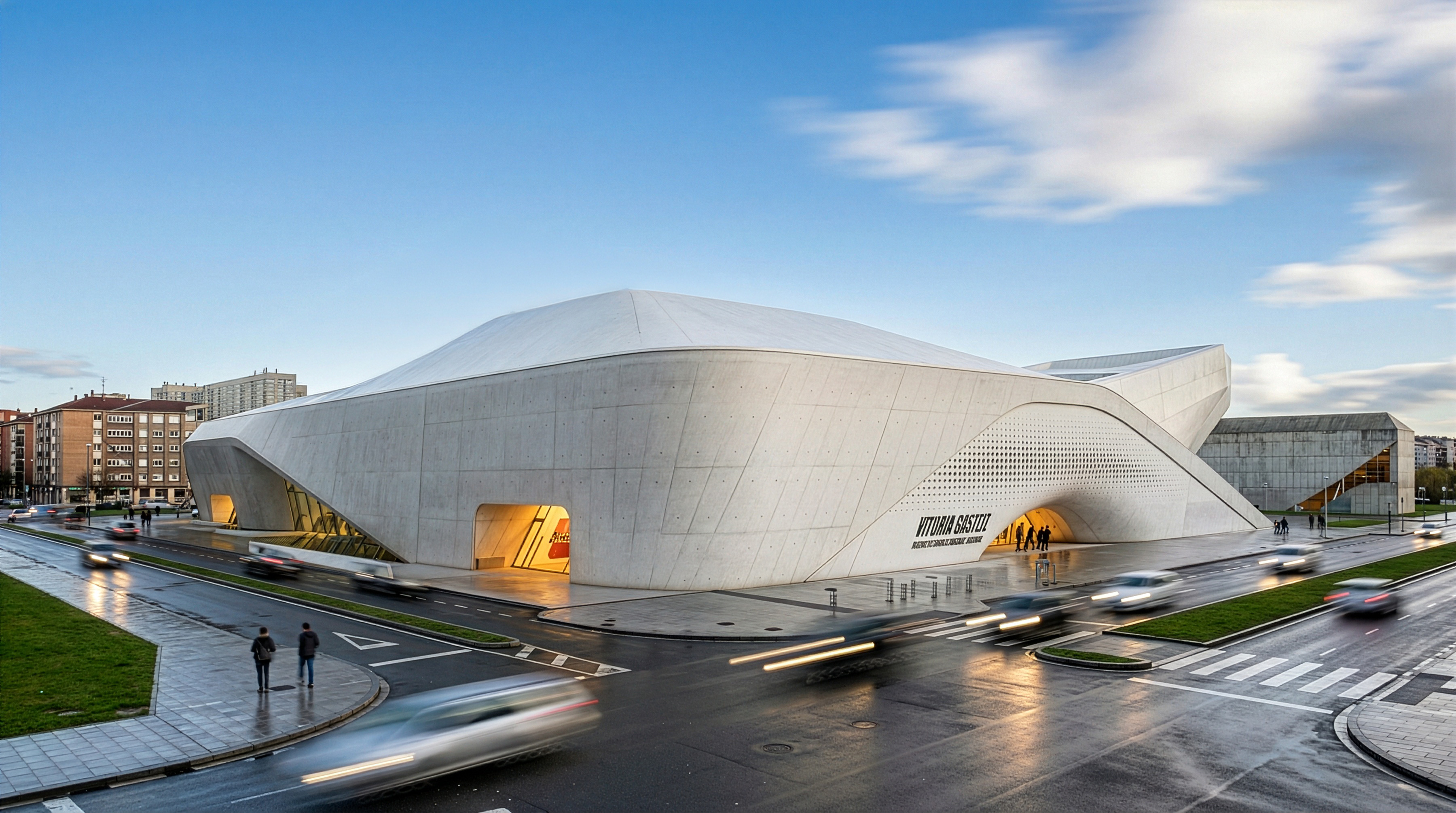 The museum seen from an elevated urban vantage point on a rainy day, its fluid white volumes rising above the surrounding streetscape