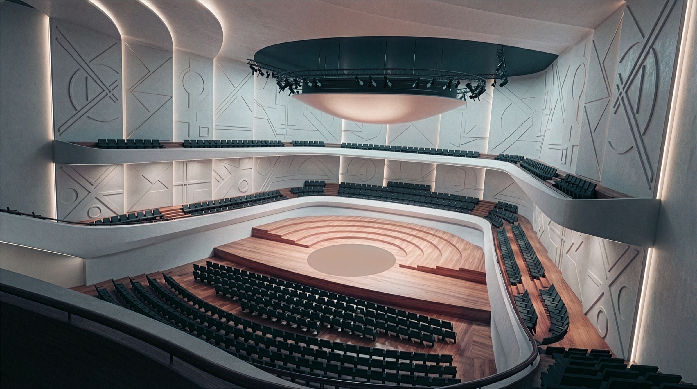 Main auditorium of the Mariinsky Performing Arts Center showing the performance stage with wooden flooring, tiered seating on two balcony levels, sculpted white wall panels with geometric relief patterns, a central circular lighting rig, and a luminous ceiling disc
