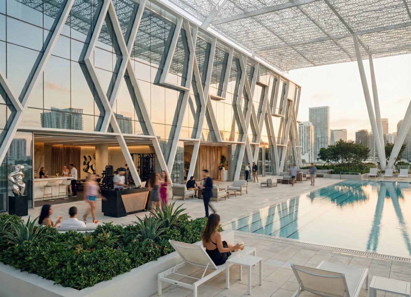 Rooftop pool terrace with lounge seating, tropical plantings, and a diagrid canopy structure overlooking the Miami skyline at dusk