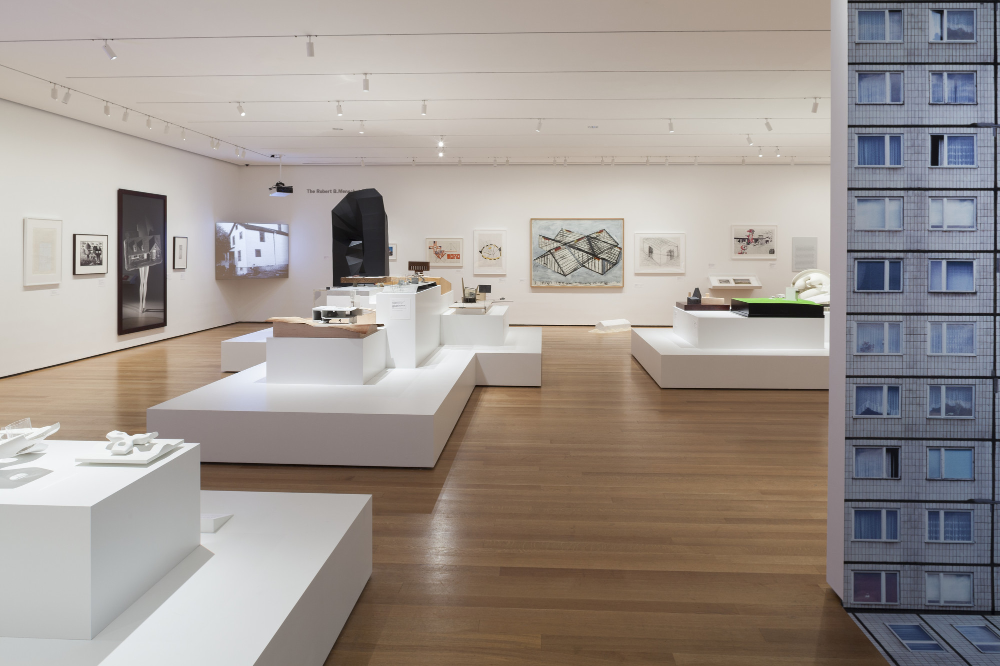 Wide installation view of the Endless House exhibition at MoMA featuring architectural models and drawings