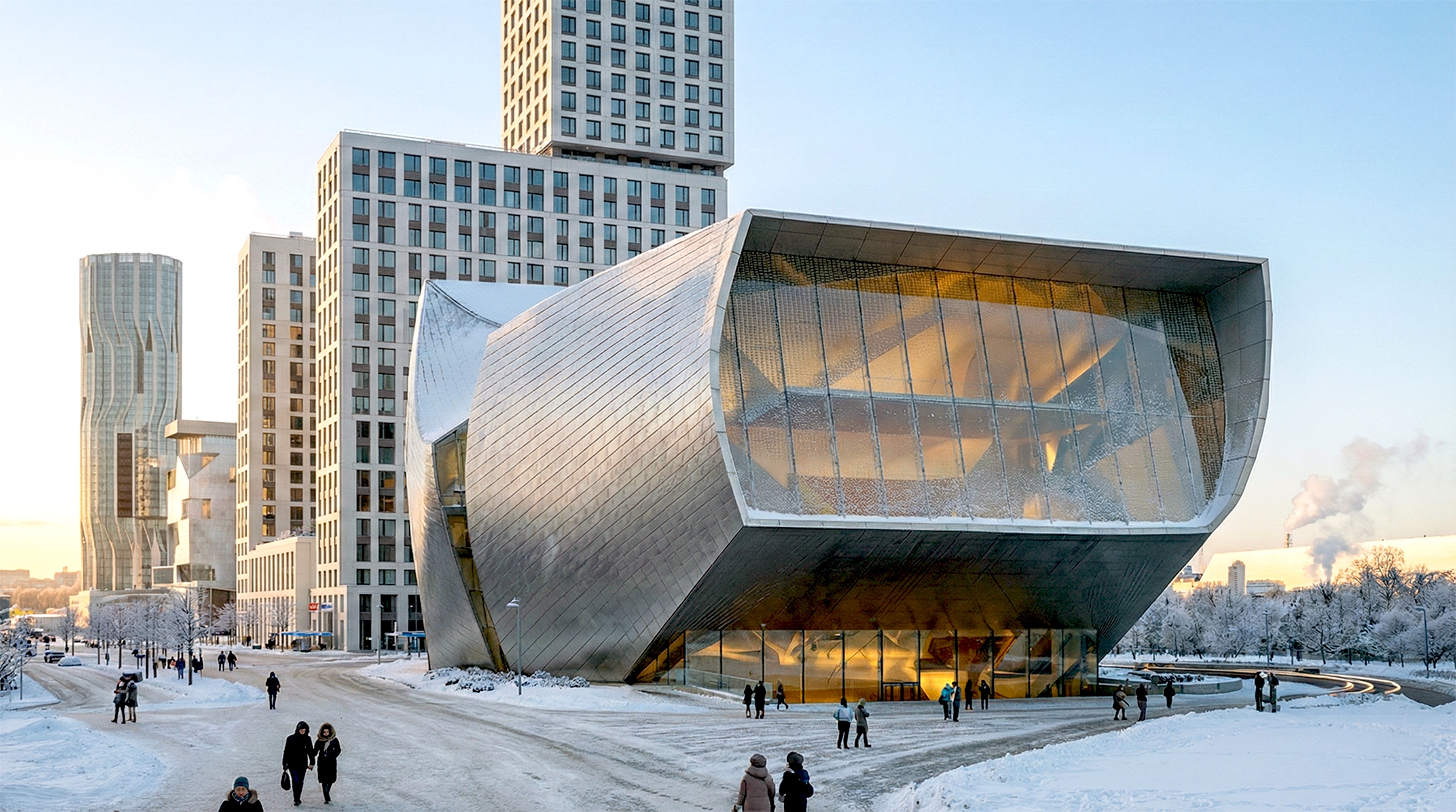 Exterior winter view of the ZIL Performing Arts Center with its sculptural metallic facade set against the Moscow cityscape